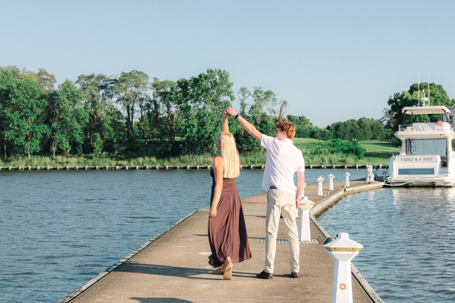 Colin twirling Samantha at the end of the dock