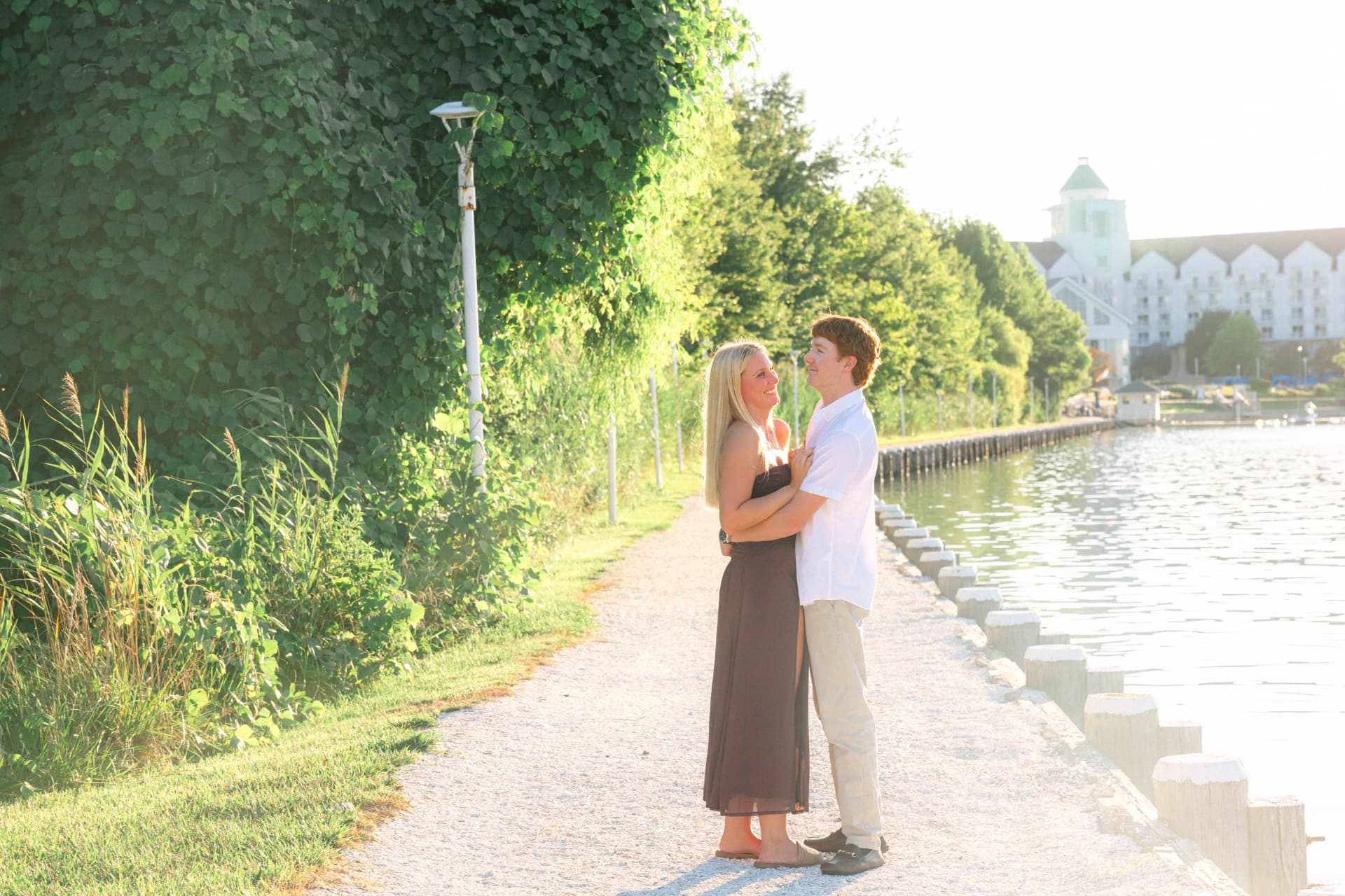 Samantha and Colin holding each other on the waterfront path