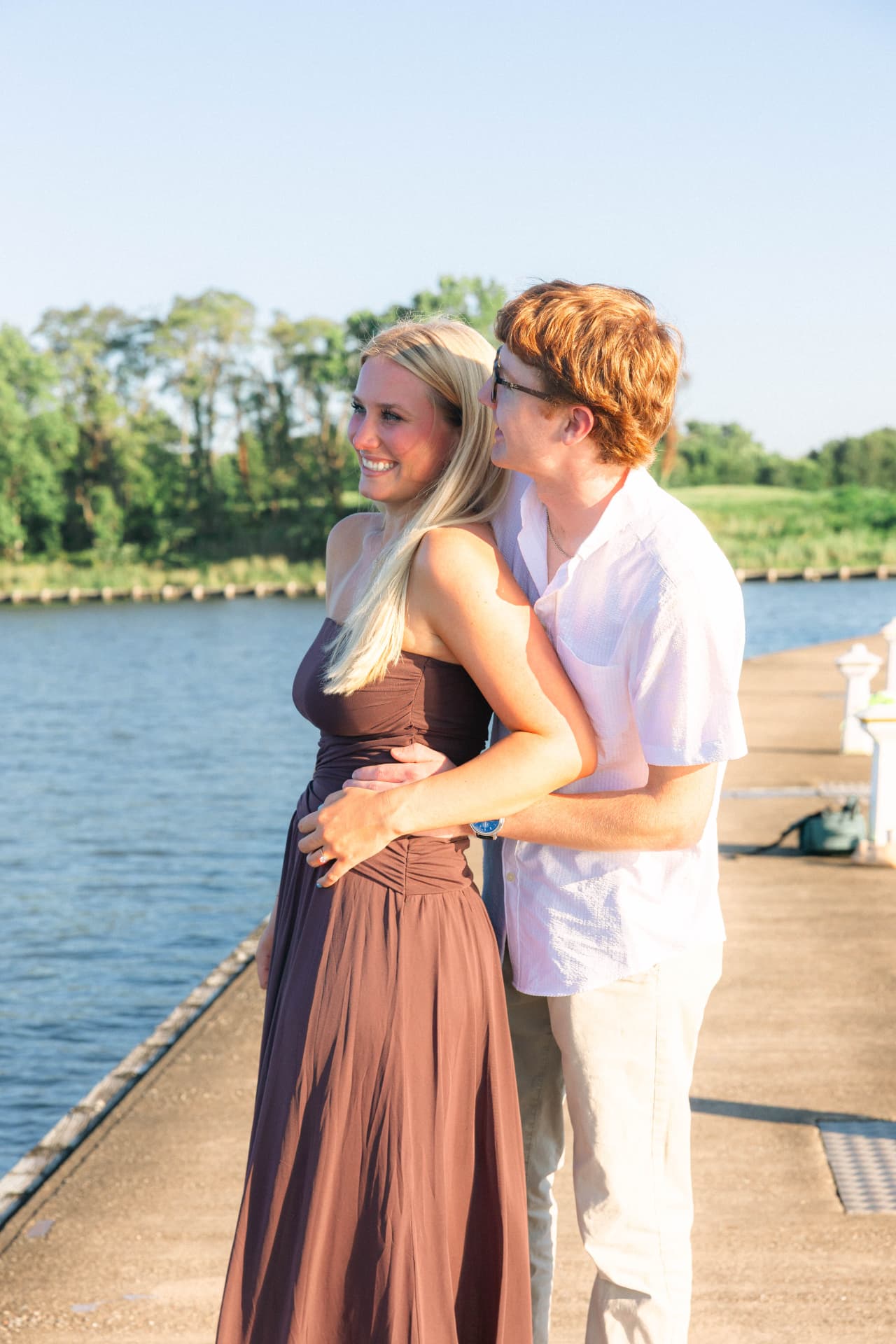 Samantha and Colin looking out over the water from the dock